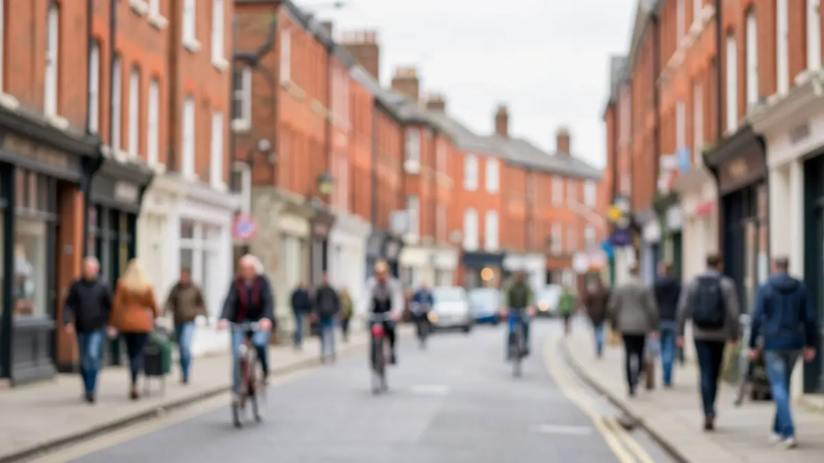 Generic image of a city street in The Midlands with pedestrians and cyclists.