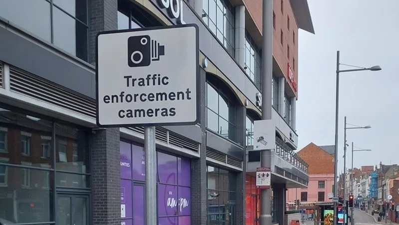 traffic enforcement cameras sign on a street