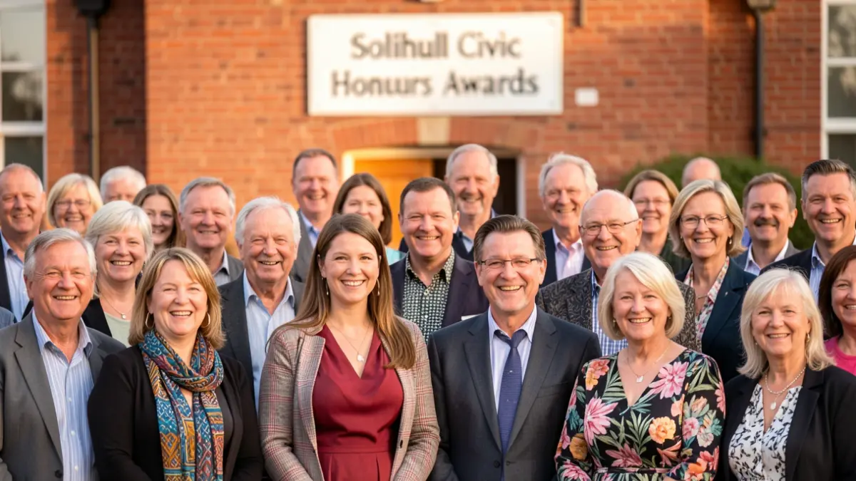 A diverse group of people smiling at a community awards event in Solihull.